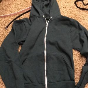 Green zip up sweatshirt.